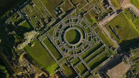 Spinning top-down aerial shot descending over Saqsaywaman Inca ruins in Peru. Stock Footage 312799652