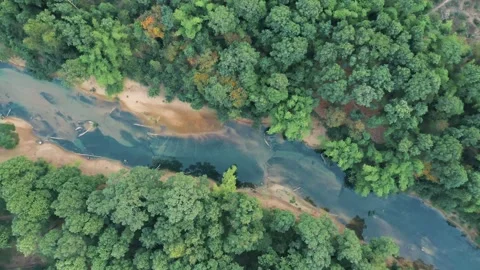 Spinning top down drone view of Nam Hinboun river in Kong Lor, Laos 스톡 동영상 247383590