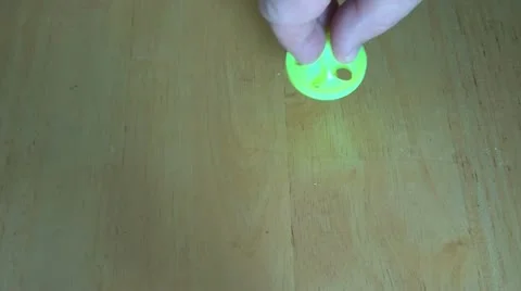 Spinning-toy-top-on-table 動画素材 12614114