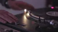 Spinning turntable, dj's hands rotating vinyl record nightclub HD Footage