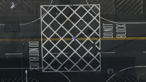 A spinning umbrella in the Intersection 4k Stock Footage 212109902