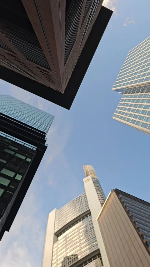 Spinning Upward View Between Modern Skyscrapers Stock Footage 344310889