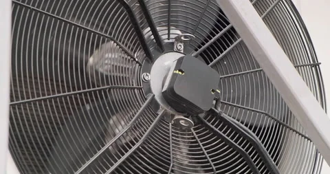 Spinning ventilator conditional an industrial space in bug sized in slow motion 動画素材 138988792