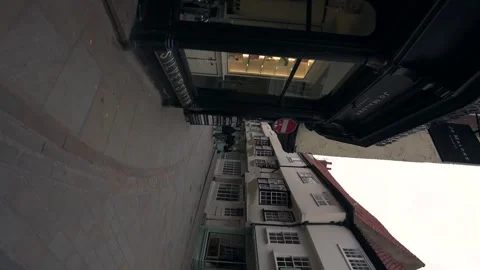 Spinning view through the streets of York, England, shops and buildings Stock Footage 315558293