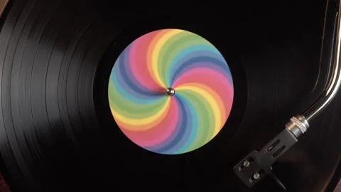 Spinning Vinyl Record With Rainbow Sticker, Close Up Top Down View Stock Footage 337997147