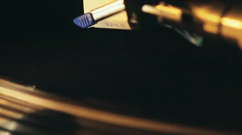 Spinning Vinyl Turntable Close-Up with Needle Coming Down Stock Footage 10796622