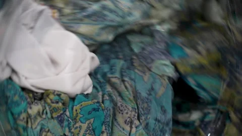 Spinning washing machine with clothes, close-up. Washing machine and colorf.. Stock Footage 290356379