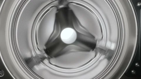 Spinning washing machine drum that stops Stock Footage 202374545