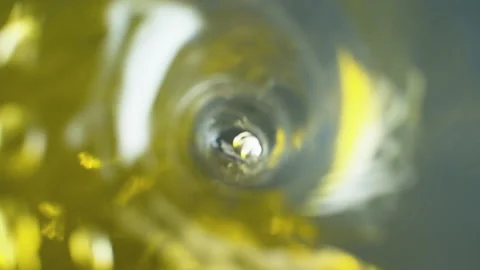 Spinning water with yellow inks Stock Footage 135352357