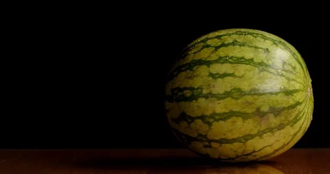 Spinning watermelon on table isolated Stock Footage 126258583