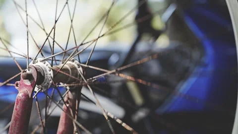 The spinning wheel of an old bicycle close-up Stock Footage 327962689