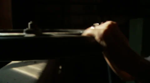 Spinning the Wheel of a Paper Cutting Machine in Natural Light 스톡 동영상 33055221