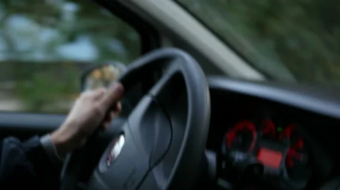 Spinning wheel on very bumpy road - the car goes with a strong shaking Stock Footage 56430187