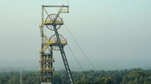 The spinning wheels of the mining shaft of the mine "Boze Dary" in Katowice Stock Footage 161409429
