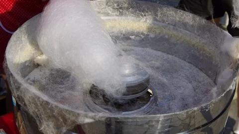Spinning white cotton candy (candy floss) at a fair. Closeup shot Stock Footage 119453601
