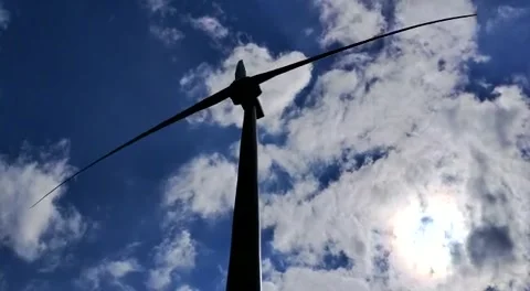 Spinning Windmill Port of Antwerp with sun behind clouds Stock Footage 198855942