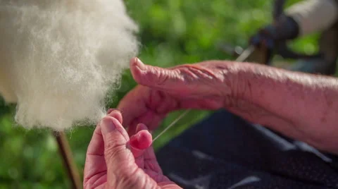 Spinning the wool to make a string Stock Footage 48189142