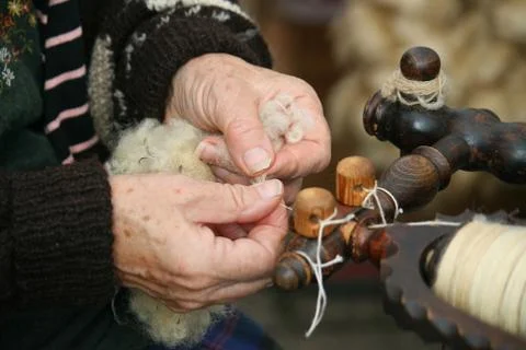 Spinning wool. Stock Photos