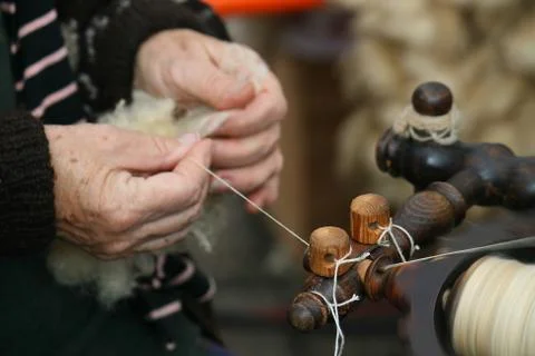Spinning  wool. Stock Photos