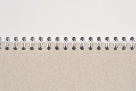 Spiral binding of a notebook with cardboard cover close up Stock Photos