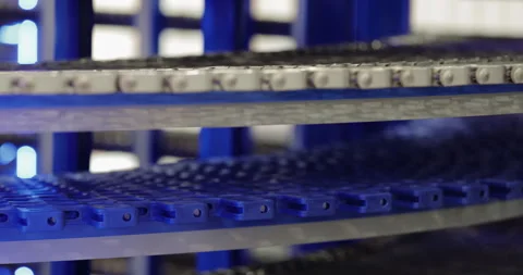 Spiral conveyor with empty boxes moves ready to transport goods at factory Stock Footage 341863999