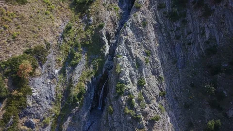 Spiral Drone Descent Along Mountain Waterfall in the Pyrenees Stock Footage 346642646