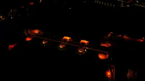 Spiral drone orbit around river dam at night Stock Footage 328037205