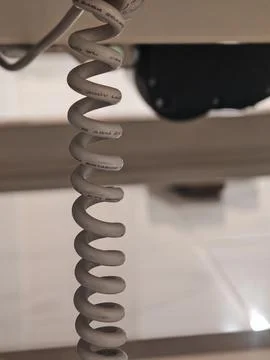 Spiral electrical cable close-up with shallow depth of field 스톡 사진
