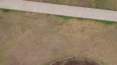 Spiral Fall to Grass Drone Stock Footage 83023713