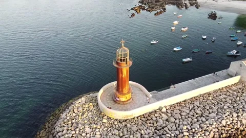 Spiral flight over lighthouse Stock Footage