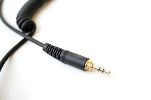 Spiral headphone audio jack cable with empty space Stock Photos