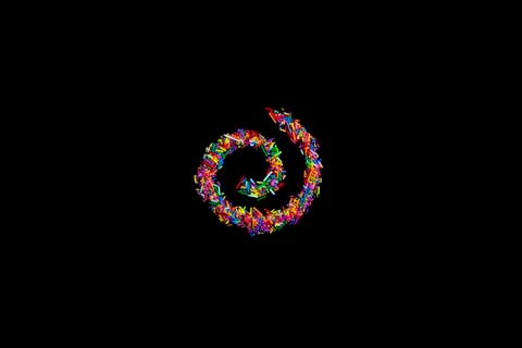 Spiral made of colorful sprinkles isolate on black background Stock Photos