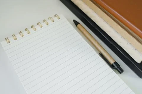 Spiral note pad opened on a new fresh page on office table top view close u.. Stock Photos