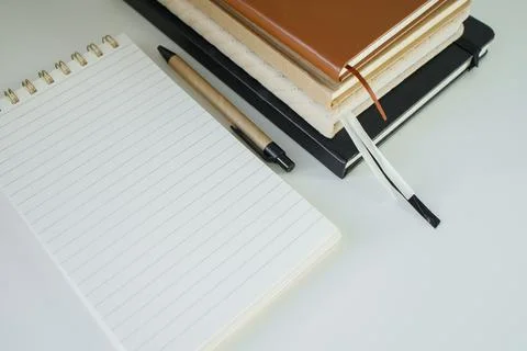 Spiral note pad opened on a new fresh page on office desk top view close up Stock Photos