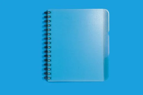 Spiral notebook on a blue background Stock Photos