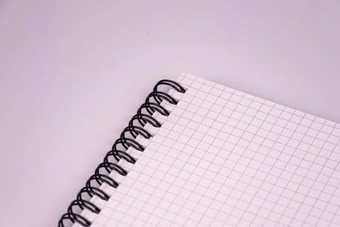 Spiral notebook with white pages on light background, emphasizing clean desig Stock Photos