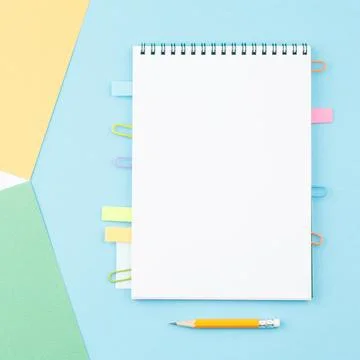 Spiral notepad on color background. Stock Photos
