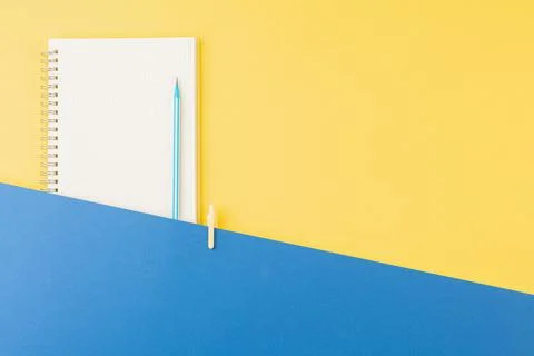 Spiral notepad with pen on office table. Stock Photos
