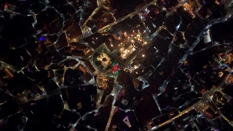 Spiral overhead flight at night over Taxco, interconnected and illuminated Stock Footage 332137822
