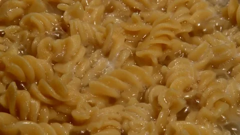 Spiral pasta is being prepared Stock Footage 314579479