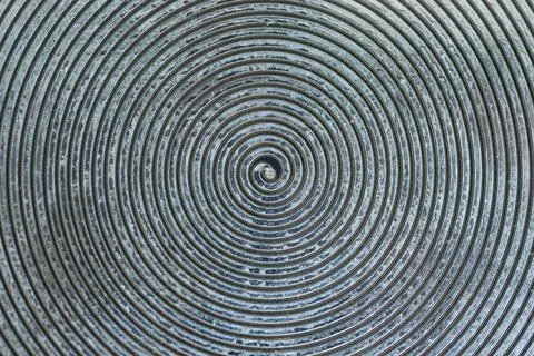 Spiral Pattern on Metal Surface Creates an Intriguing Visual Effect in Natu.. Stock Photos