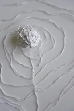 The spiral pattern of the white thread with white ball Stock Photos