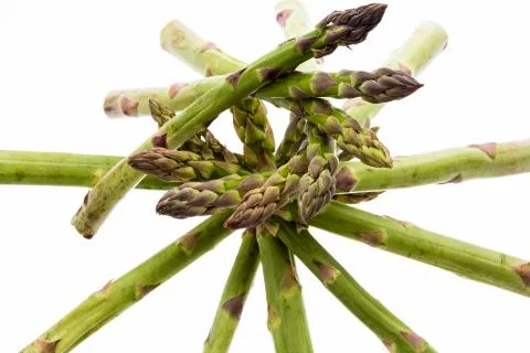 Spiral-shaped stack of green asparagus spears Stock Photos