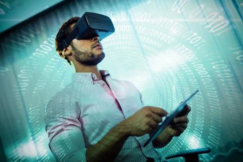 Spiral of shiny binary code against businessman using an oculus Stock Photos