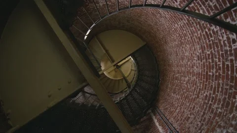 Spiral staircase on the interior of old brick lighthouse on the Oregon coast Video stock 148284808