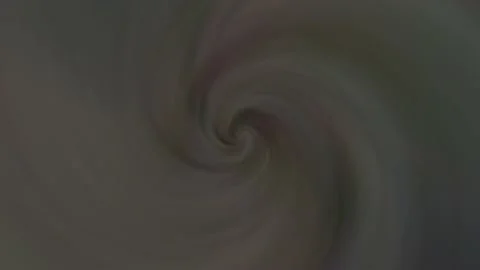 A spiralling glow spreads out in the centre of the smoke-filled screen. Stock Footage 239458241