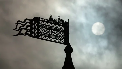 The spire of the castle. The sun is in the clouds. TimeLapse. Stock Footage 79846860