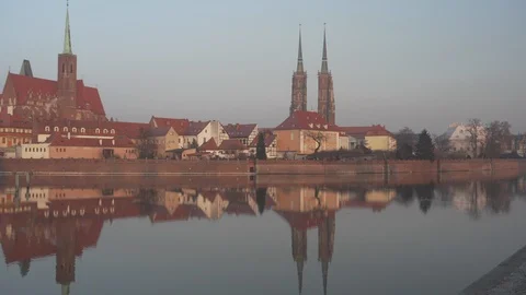 Spires of Cathedral of St John Baptist reflected in water in Wroclaw Stock Footage 108300023