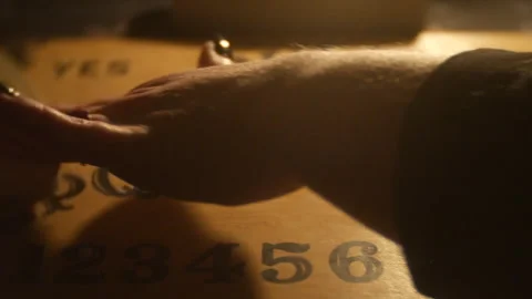 Spirit board planchette moving Stock Footage 333646871