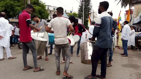 Spirited young Musicians seen beating the Drum Instruments  in India. Stock Footage 186325822
